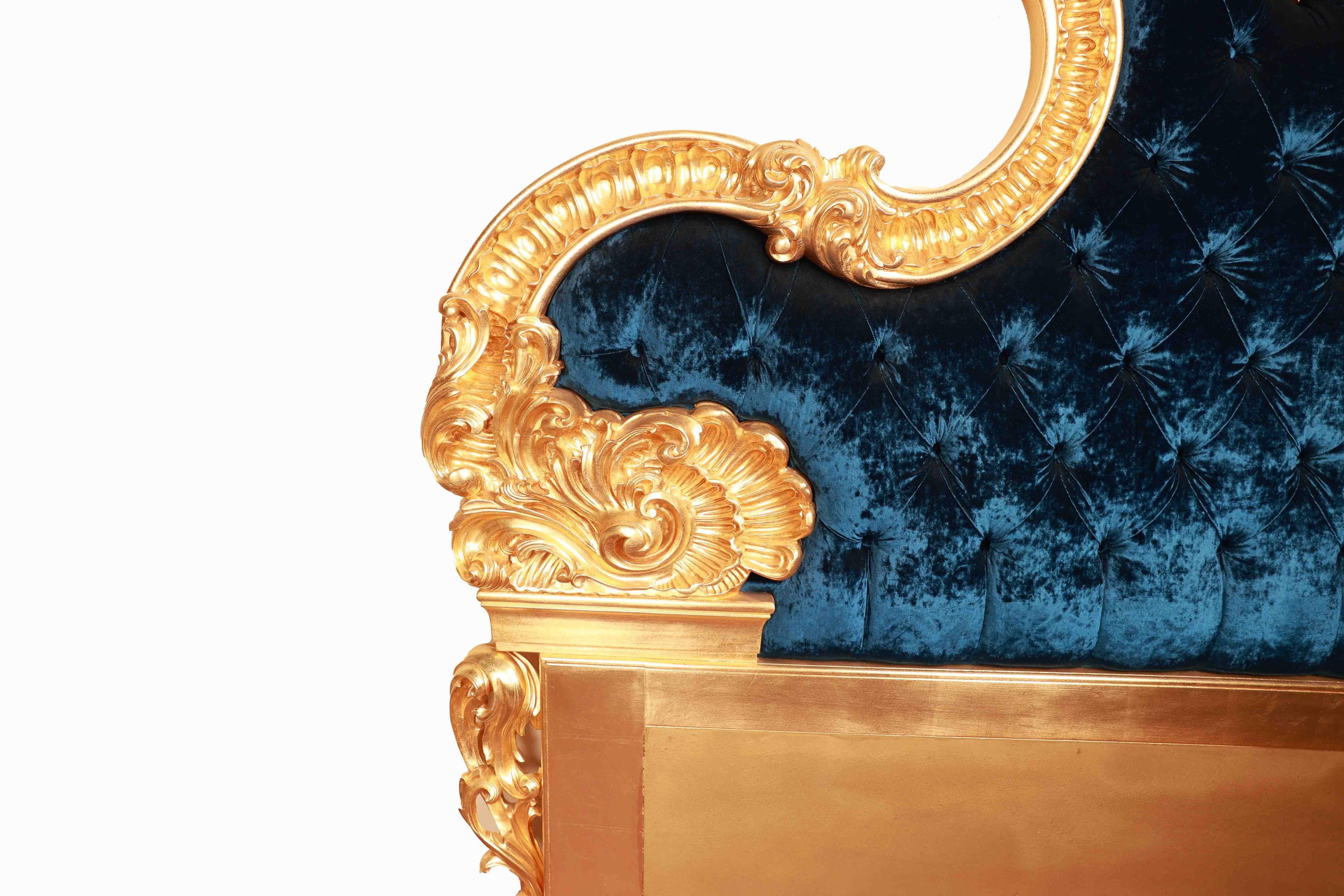 Bed headboard with gold frame and blue tufted velvet backrest
