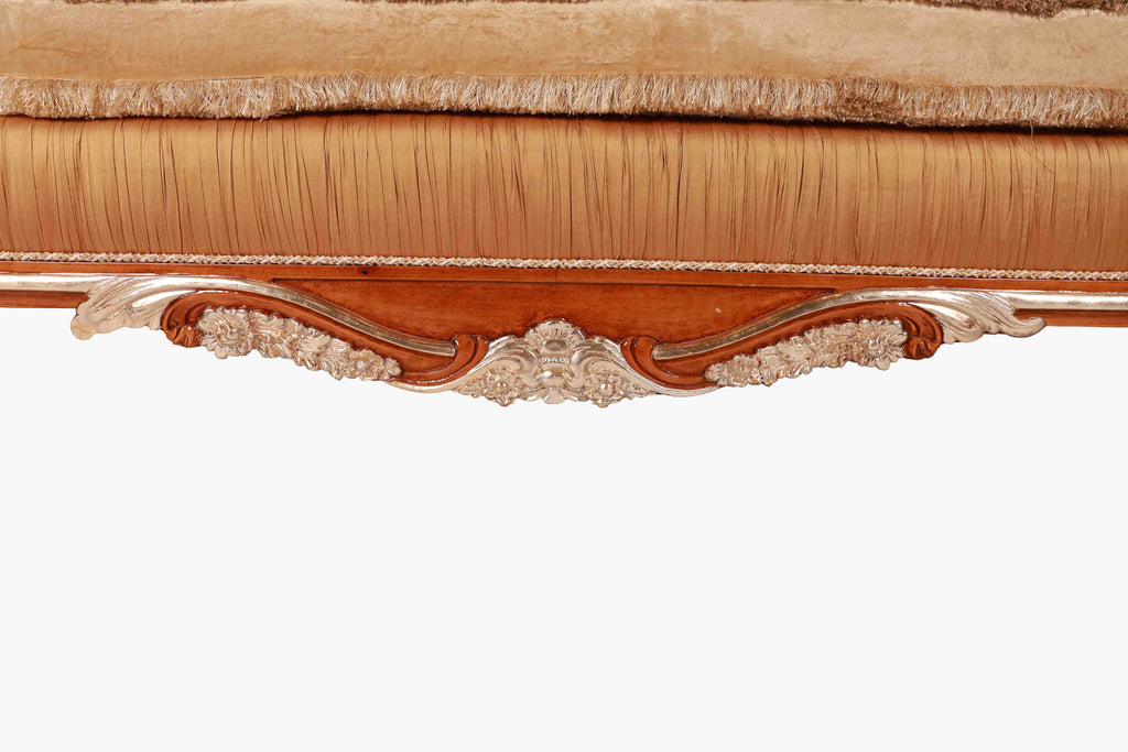 Close-up of a decorative wooden cornice with intricate carvings