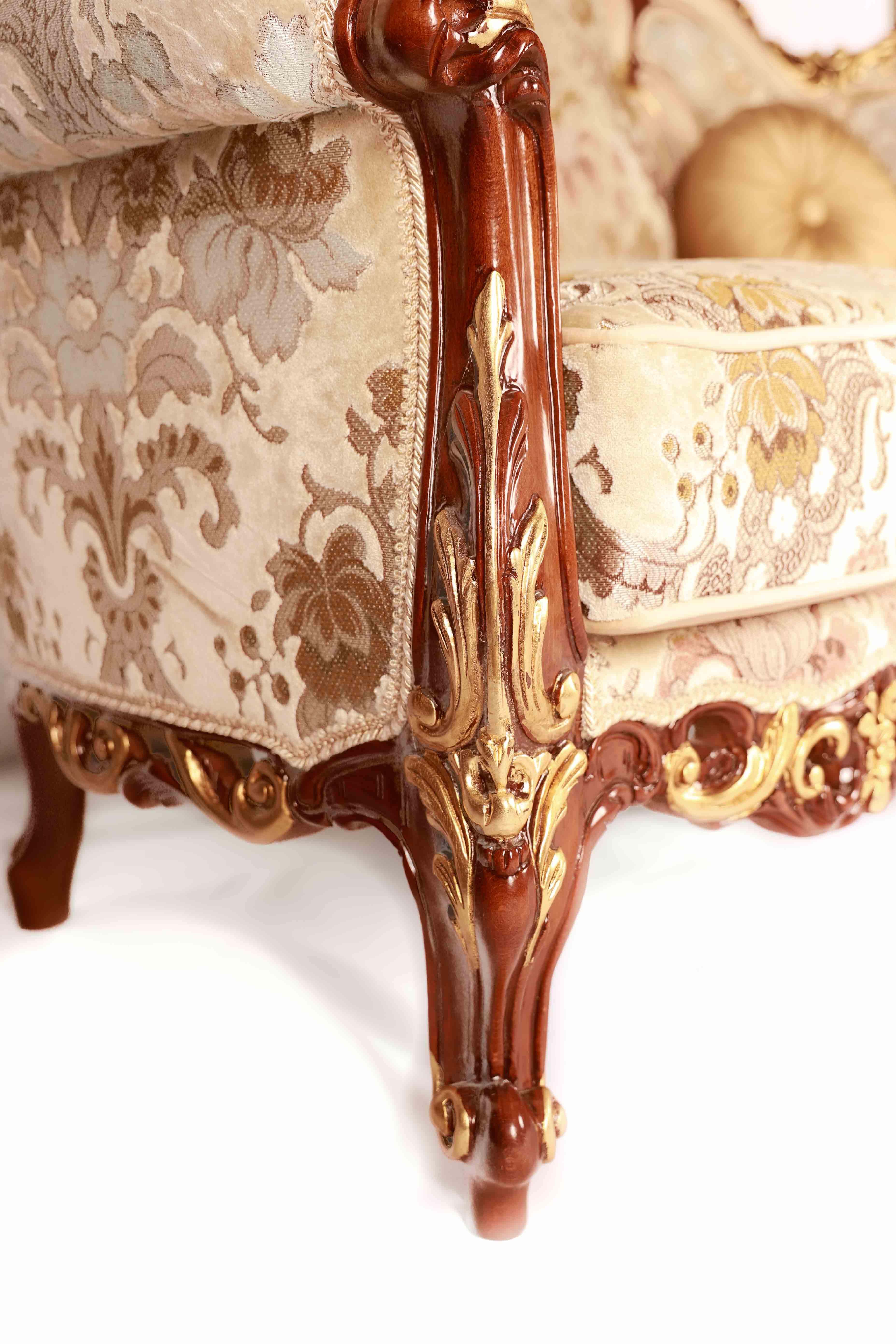 Decorative armchair with intricate floral patterns and wooden frame 
