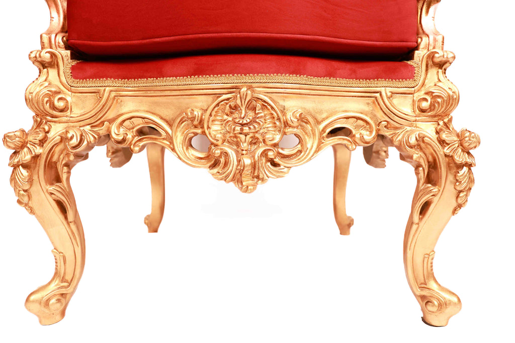 Decorative chair with gold frame and red cushion