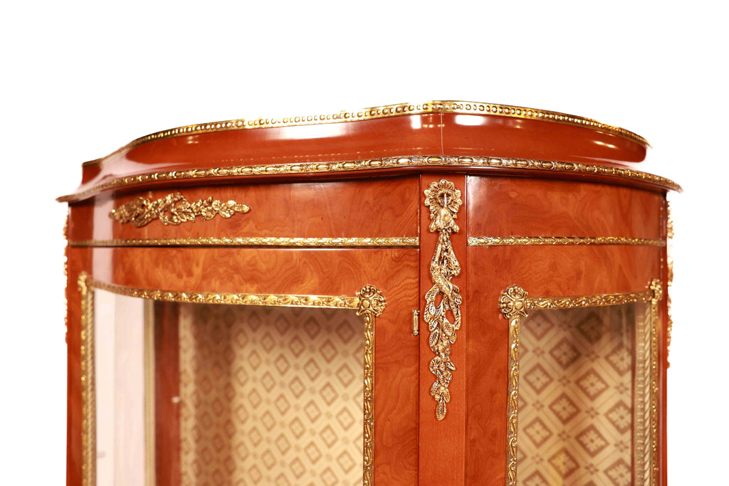 Decorative wooden cabinet with gold accents