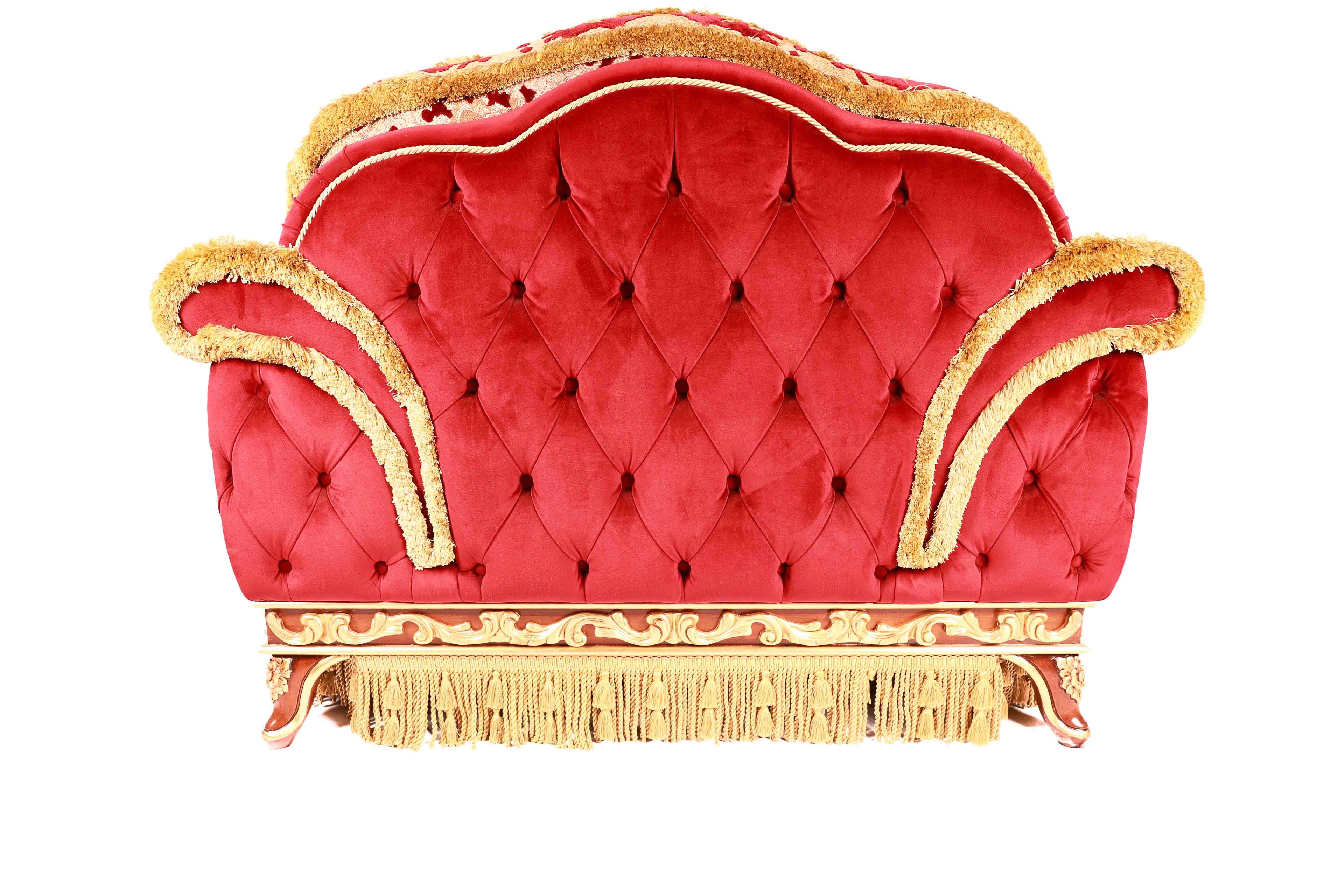 Red tufted sofa with gold trim