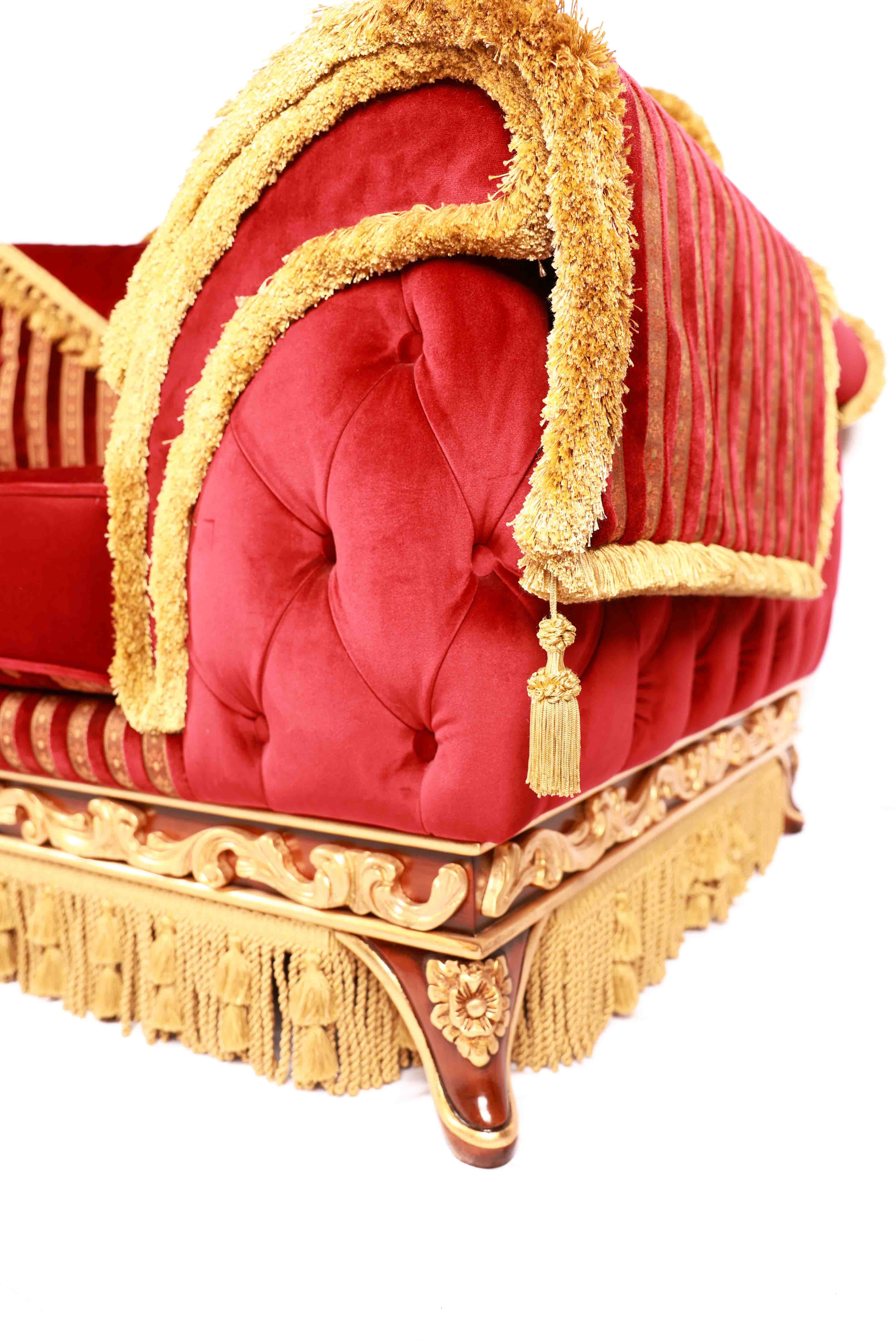 Red velvet pet bed with gold trim and tassels 